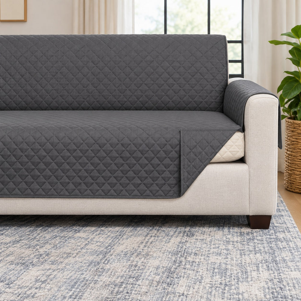 Close detail of the Couch Guard reversible quilted sofa cover