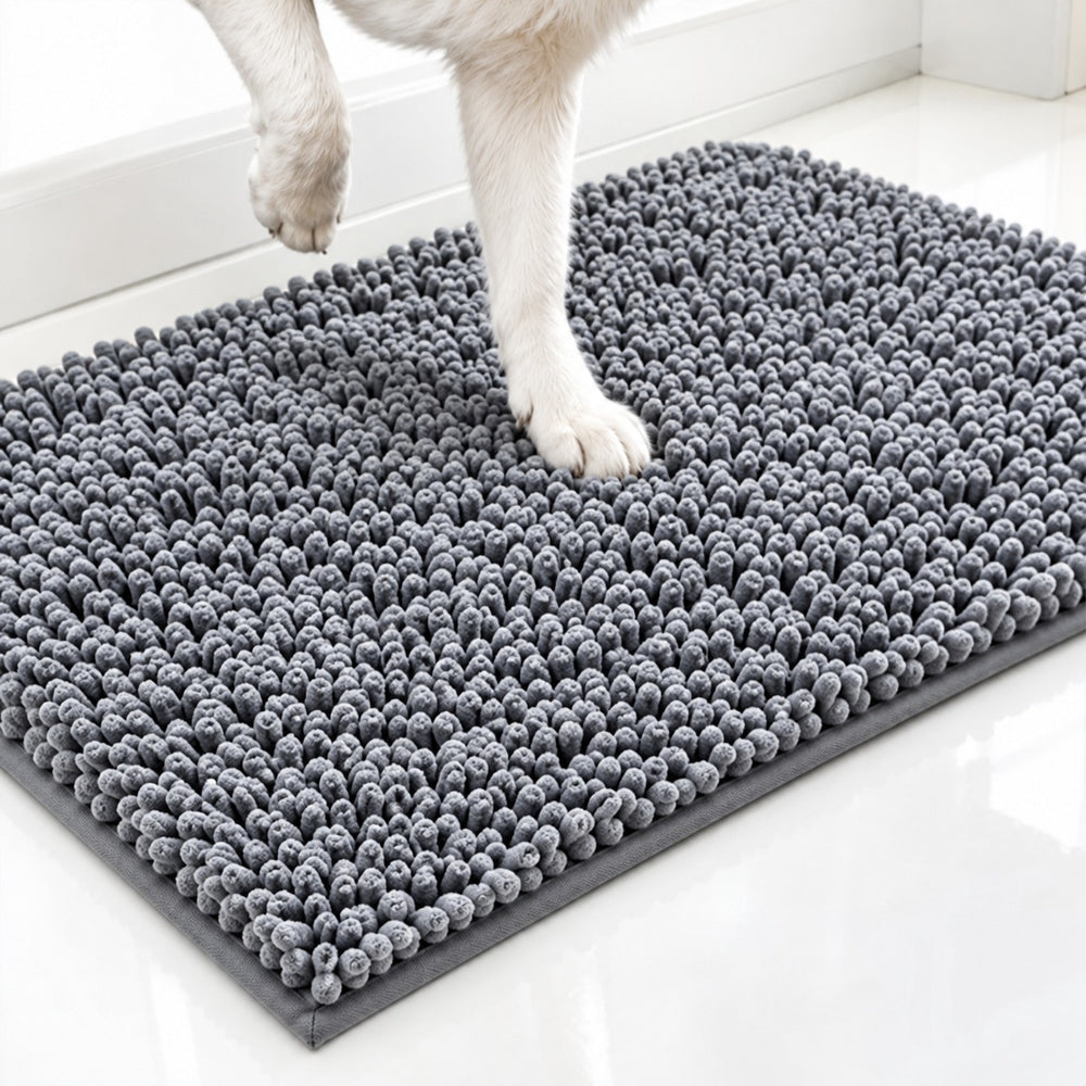 Close-up of paws stepping onto the MudStop absorbent mat